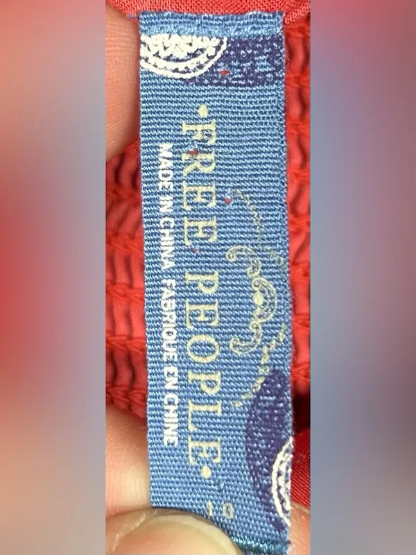 Free People Blue Label on Red Fabric - Image 3