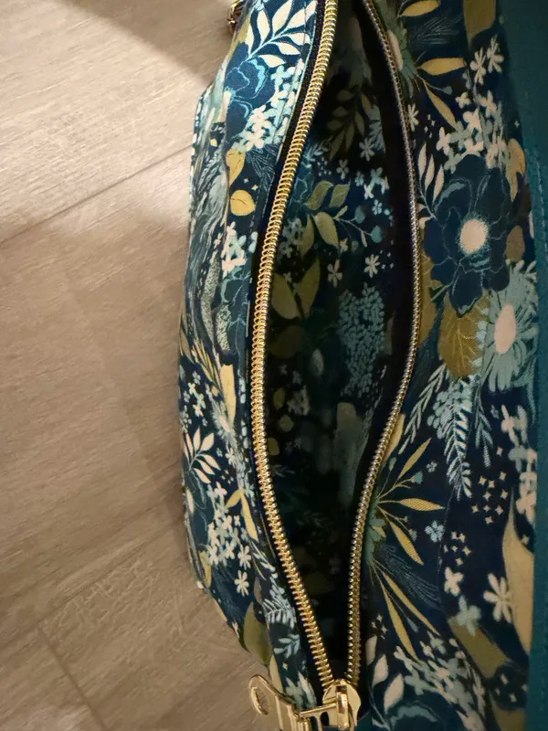 Floral Over-the-Shoulder Handbag - Like New Description Beautiful woman's shoulder bag in perfect, like-new condition! It features a vibrant blue, green, and yellow floral pattern on the exterior (as shown in image This elegant handbag is designed strictly for over-the-shoulder wear. It offers exceptional organization with an easy-access exterior zippered pocket and a spacious, spotless interior lined with a classic geometric grid pattern With absolutely zero signs of wear, this gorgeous bag looks completely brand new and is ready for its next home. Ships quickly from a smoke-free home - Image 2
