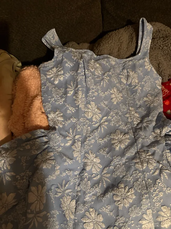 Light blue ladies dress with an all-over white floral print. Fit-and-flare silhouette with wide shoulder straps for comfortable wear. Soft woven fabric offers gentle structure and twirl-ready skirt. Perfect for parties and special occasions. - Image 2