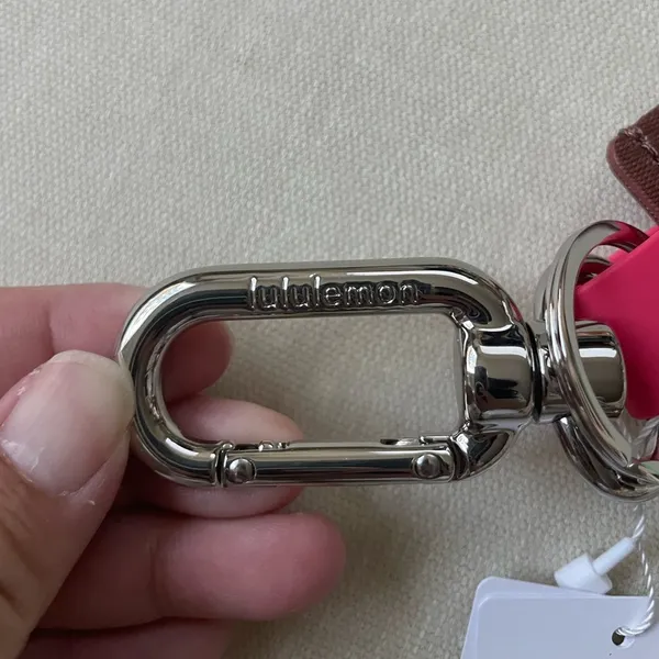 Lululemon Never Lost Keychain Wordmark - Ancient Copper/Glaze Pink - Image 3