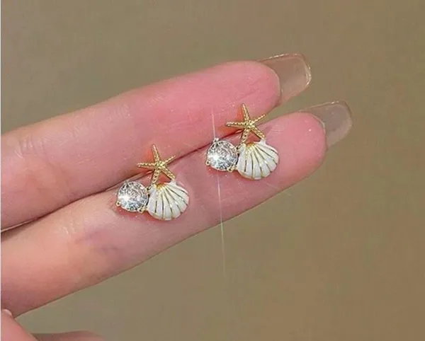 Gold and White Starfish Shell Earrings - Image 2