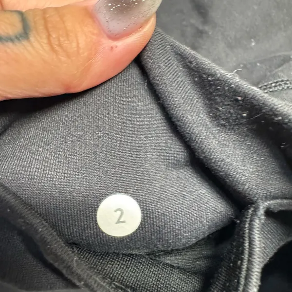 Lululemon Black Leggings with Sheer side panels with Criss Cross details- size 2 - Image 3