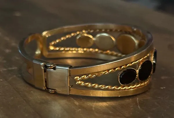 Gold tone open hinged bangle with oval black stones - Image 6