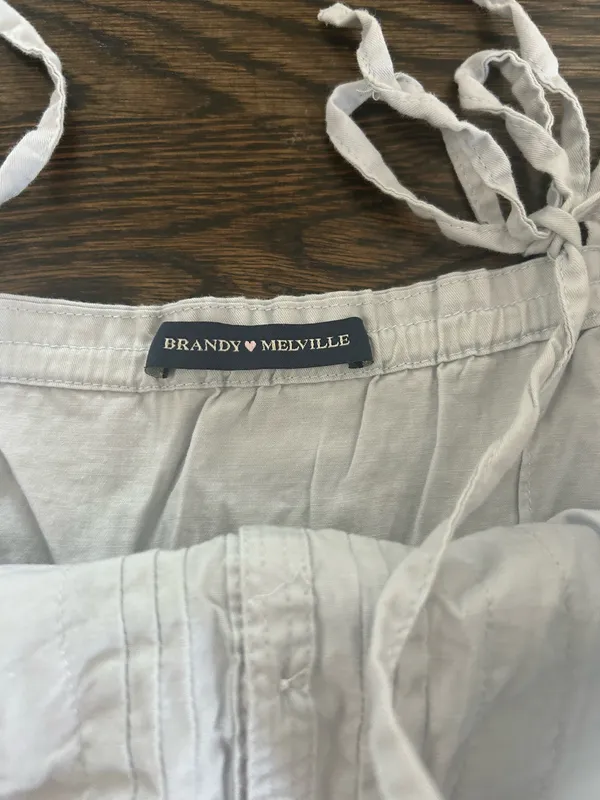 Baby blue Brandy Melville Maeve lace cami top with button-up front and ruffled hem - Image 3