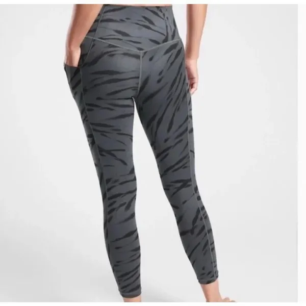 Athleta M salutations stash pocket II zebra stripe tight 7/8 leggings - Image 2