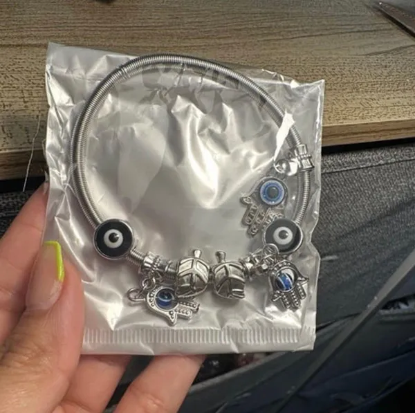 Silver bracelet with evil eye charms. - Image 3