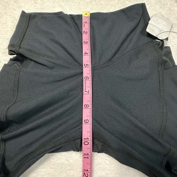 UFC Women's Black Bike Shorts with Red Logo and Side Pockets - Image 9