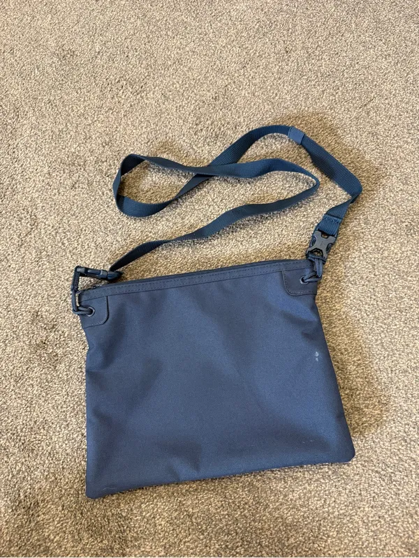 Herschel navy blue crossbody bag with red/white striped lining - Image 2