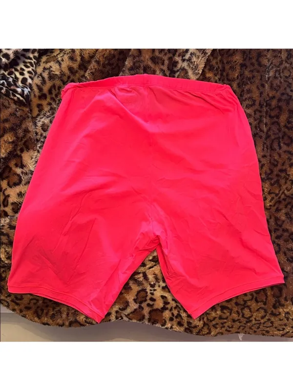 SKIMS Vibrant Coral Colored Thin Bike Shorts - Image 3