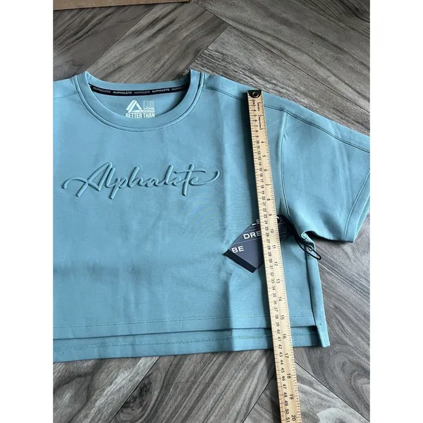 Set 2 Pcs Alphalete Women's ELMTS Short Sleeve Crop & Relaxed Coffed Jogger Teal - Image 10