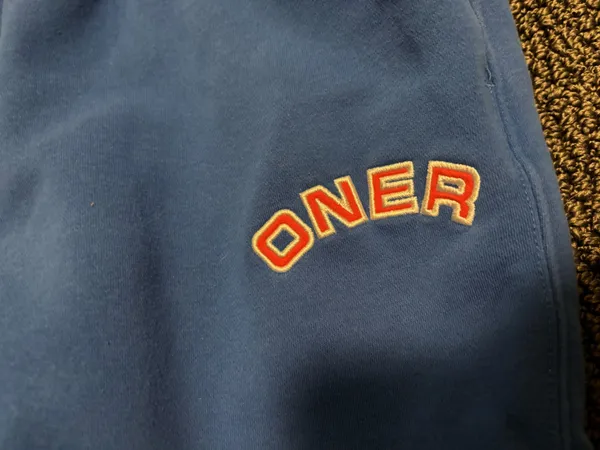 oner active bright blue sweatpants with red and white embroidery - Image 2