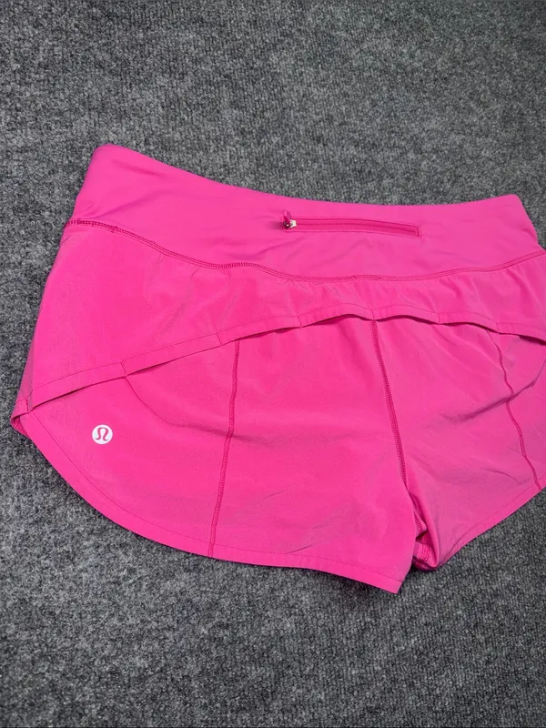 Lululemon Speed Up Shorts in the bright Sonic Pink colorway - Image 7