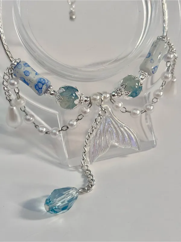 Handmade Hand Crafted Silver Bracelet with Blue and White Beads and Mermaid Tail Charm - Image 2