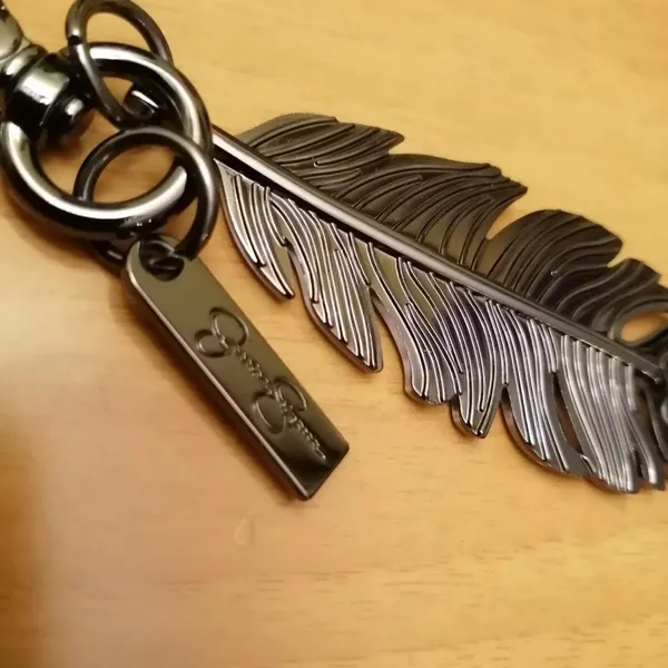 Jessica Simpson Pewter Solid Feather Color Keychain Bag Charm, Luggage Charm - Image 3
