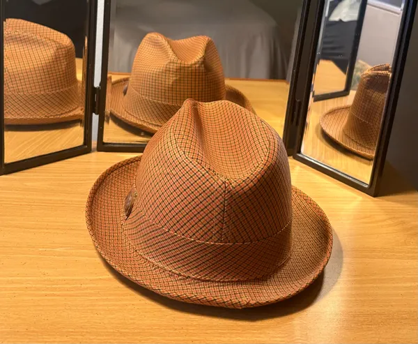 This Men’s Top Hat in size Medium is a stylish and lightweight accessory perfect for casual occasions during the winter, fall, and spring seasons. Made of wool felt in a solid brown color, this handmade top hat exudes a classic and sophisticated look. With its unique style and comfortable fit, this top hat is sure to add a touch of elegance to any ensemble. - Image 8