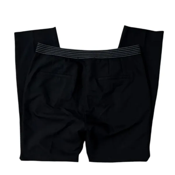 ZARA BASIC Collection Black trousers zip hem Back stripe straight leg size Lg The ZARA BASIC Collection Black trousers are stylish dress pants in size L with a zip hem feature and back stripe accents. Made from a fabric blend of blended polyester, these pants have a straight leg style and pockets for added convenience. Perfect for casual occasions in the summer, fall, and spring, these trousers are machine washable for easy care. The black pants with stripes offer a city-inspired theme, making them a versatile and chic addition to any woman's wardrobe. - Image 5