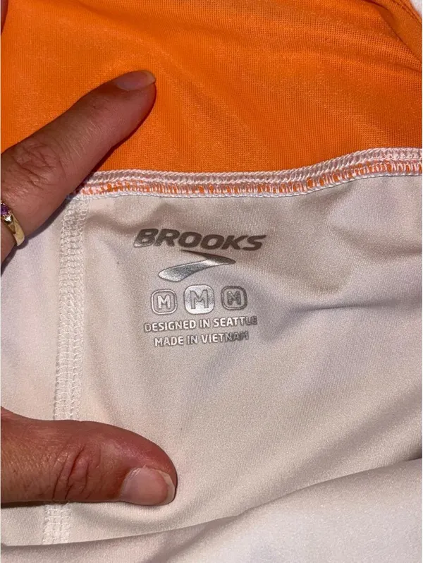 white and orange Brooks Chaser Skort - Image 4