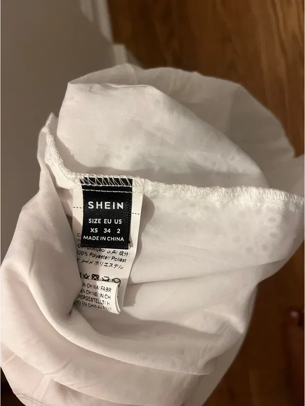 SheIn White strapless mini dress with black trim and tie detail. Size: XS - Image 3