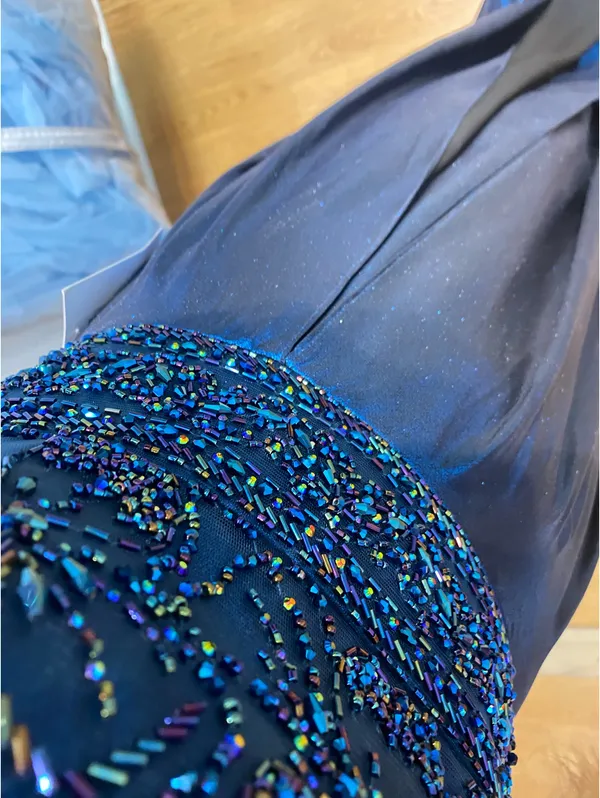 Brand new Ellie Wilde metallic blue prom dress. Never worn, no alterations. Beaded bodice, open back, and slit. Paid $700. Beautiful designer gown in perfect condition. - Image 4