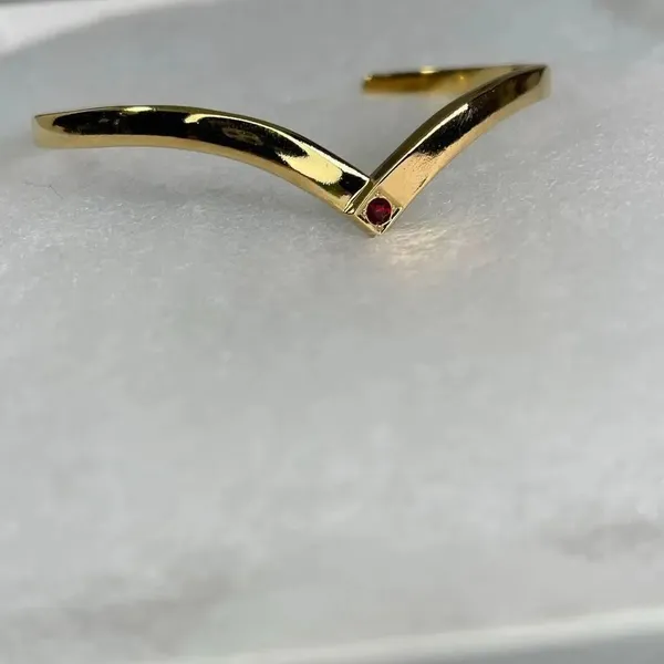 Avon gold tone V shaped cuff bracelet with faux ruby or garnet. Large - Image 3