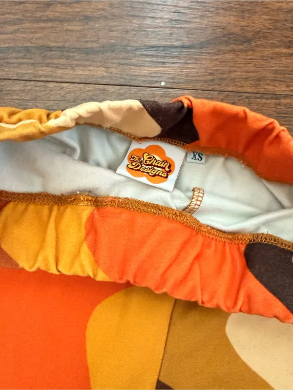 Retro Wave Flared Pants in Orange, Yellow & Brown- the chain design - Image 2