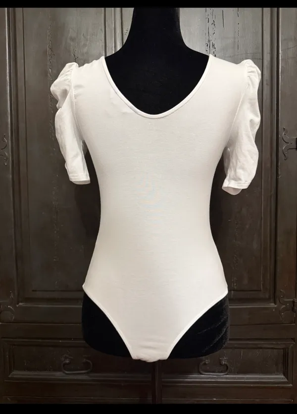 Vylette White bodysuit with Puffy Sleeves - Size Medium. ***refer to measurements. Super Cute top gentle worn and in excellent condition. Cotton/ spandex material. Measurements approximately for the bodysuit/ 14” from armpit to armpit x 25” from shoulder to snaps in crotch. Non-smoking home. Priced to sell at as is condition. Don’t like my price please make reasonable offer. - Image 5