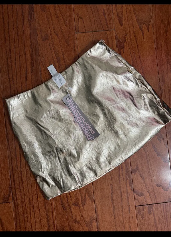 Missguided Gold faux leather skirt - size Smal NWT ***Refer to measurements. Beautiful skirt to wear out on a party trip. Fun & spunky. Measurements approximately 15” waste x 14” long. Non- smoking home. priced to sell at as is condition. Don’t like my price, make reasonable offer! And thank you for checking my closet. - Image 2