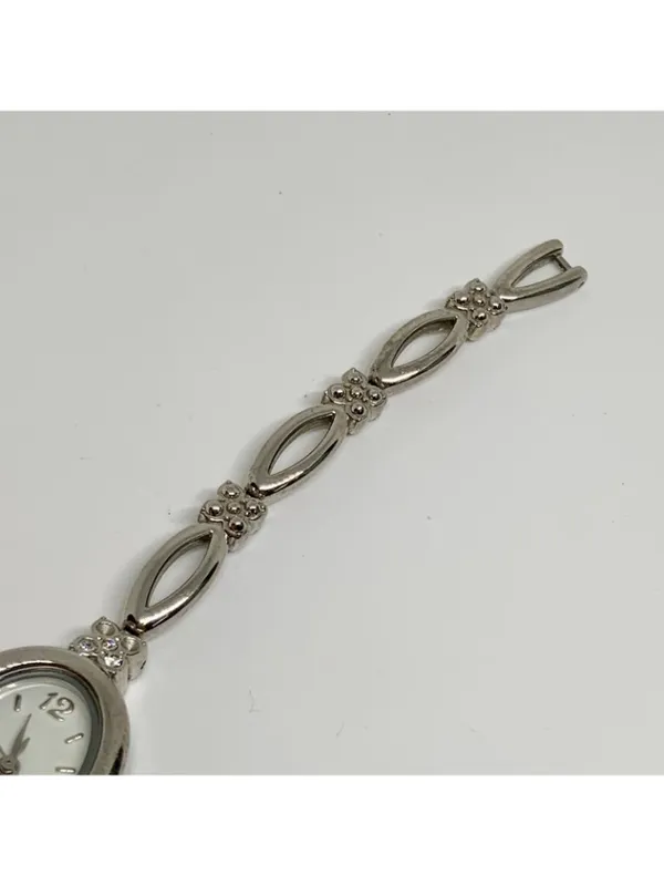 Silver tone women’s quartz analog watch 19mm oval white dial rhinestones running - Image 4