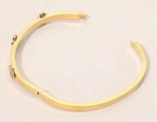 Stainless Steel Center Quatrefoil Station Hinged Bangle Bracelet - Image 2