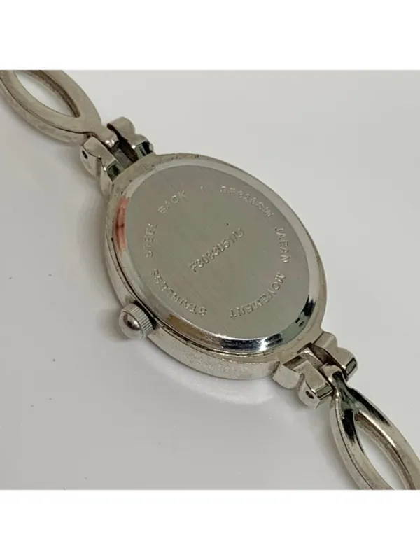 Silver tone women’s quartz analog watch 19mm oval white dial rhinestones running - Image 6