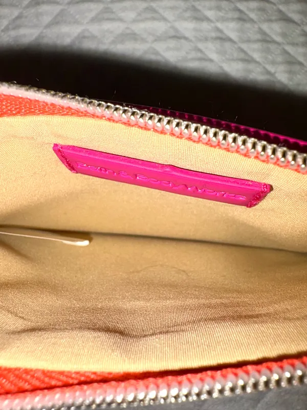 Small fuchsia pink patent leather makeup bag from Bath & Body Works with a gold metallic medallion pull. - Image 4