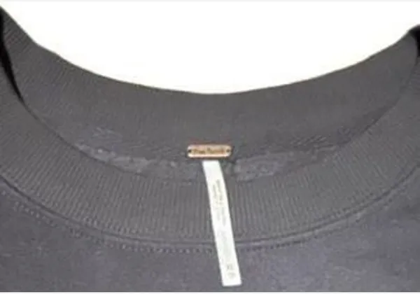 Free People She's Just Cute pullover sweatshirt in Washed Black. Size XS. Crew neck with floral fabric ruffle detail. Pre-owned with on spot of peeling shown in last photo - Image 3