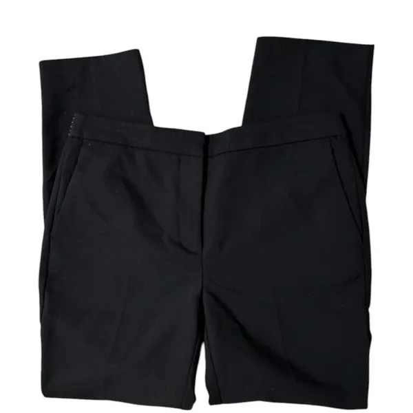 ZARA BASIC Collection Black trousers zip hem Back stripe straight leg size Lg The ZARA BASIC Collection Black trousers are stylish dress pants in size L with a zip hem feature and back stripe accents. Made from a fabric blend of blended polyester, these pants have a straight leg style and pockets for added convenience. Perfect for casual occasions in the summer, fall, and spring, these trousers are machine washable for easy care. The black pants with stripes offer a city-inspired theme, making them a versatile and chic addition to any woman's wardrobe. - Image 4
