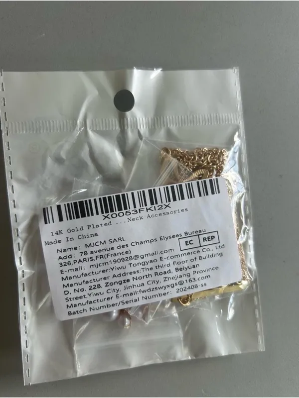 14K Gold Plated Multi-Layered Necklace with Star, Key, and Butterfly Charms - Image 3