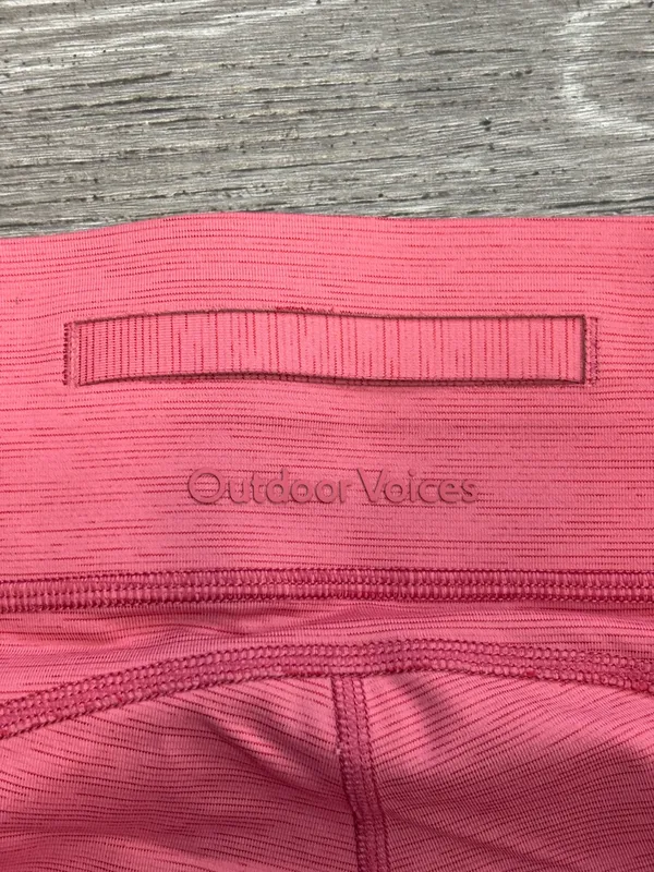 Outdoor Voices two-tone, cropped leggings featuring a distinct pink and light pink colorblock - Image 4