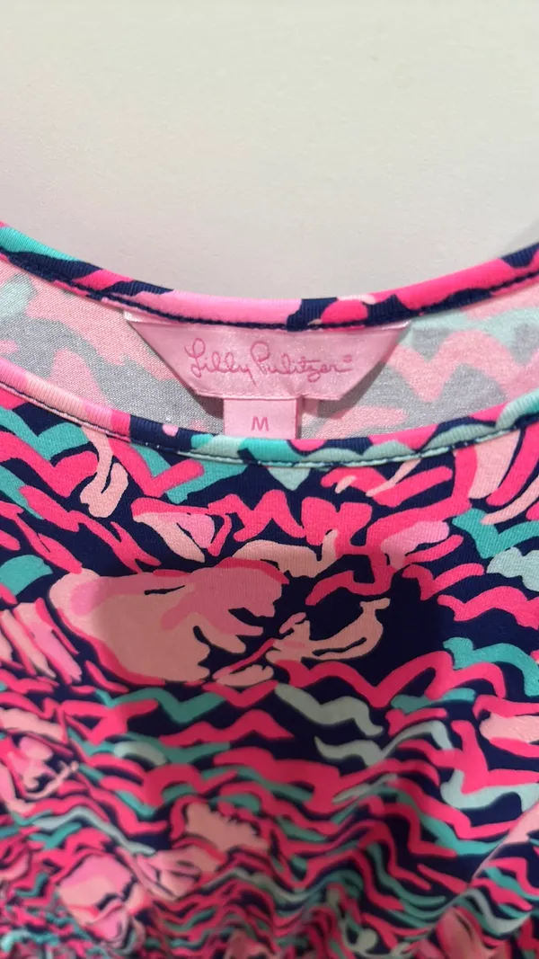 Lilly Pulitzer Romper - Size M Authentic Lilly Pulitzer - Made in China Size: Medium Print: Vibrant abstract in Hot Pink, Navy, Teal / Aqua - Flamingo / shell print - so cute! Style: Sleeveless tank romper, scoop neck, smocked / elastic waist with gold drawstring, shorts bottom show less - Image 2