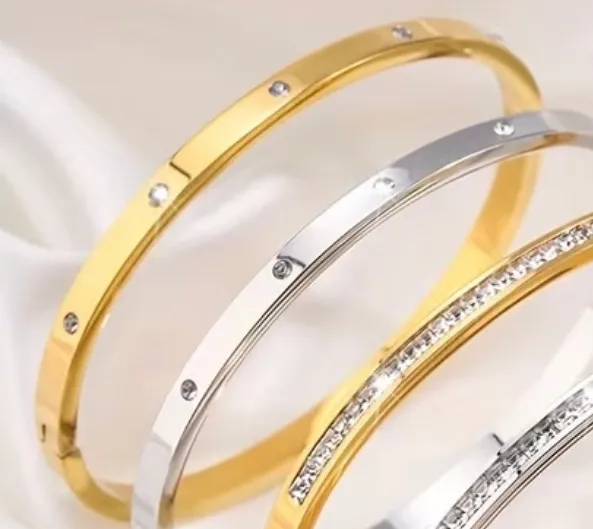 Gold stainless steel bangle with rhinestones - Image 2