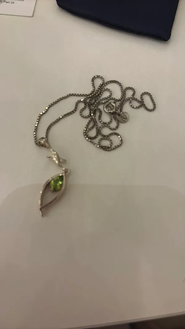 Silver necklace and earrings set with green gemstones - Image 2