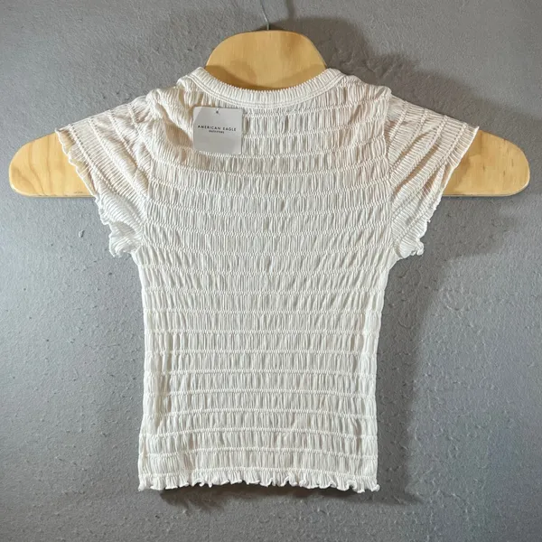 919 | NWT American Eagle Smocked Lettuce Edge Baby Tee White Womens‎ M - Image 2
