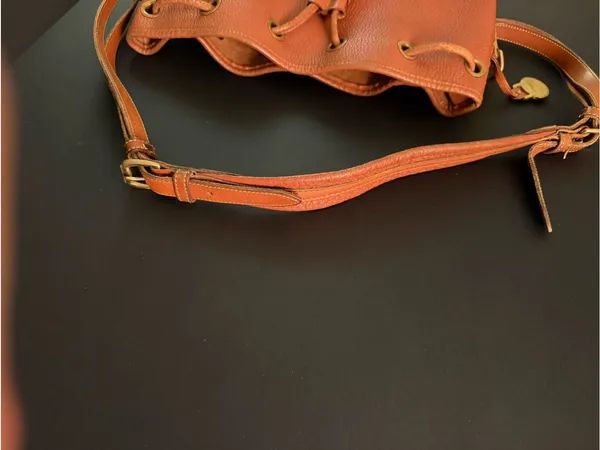 Dooney & Bourke Orange Pebble Leather Bucket Bag with Tassel Drawstring - Image 8