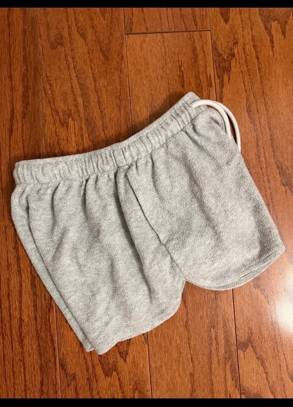 Colsie light gray terry fleece lounge shorts - Size XS. light gray terry fleece lounge shorts feature a comfortable elastic drawstring waistband, curved dolphin hem, and side pockets. Gently warn and in excellent condition. Measurements approximately 11” not fully stretched out from elastic waste x 10” long. Non smoking home. priced to sell at as is condition. Don’t like my price, make reasonable offer! And thank you for checking my closet. - Image 2