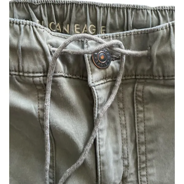 American Eagle -ARMY GREEN JOGGER PANTS-SIZE 2 Elastic waist with drawstring, zip front, two front and two back pockets, elastic ankles with a side zipper, excellent condition Measurements: Waist: side to side 13-16 inches Rise: 9 inches Inseam: 37 inches - Image 6