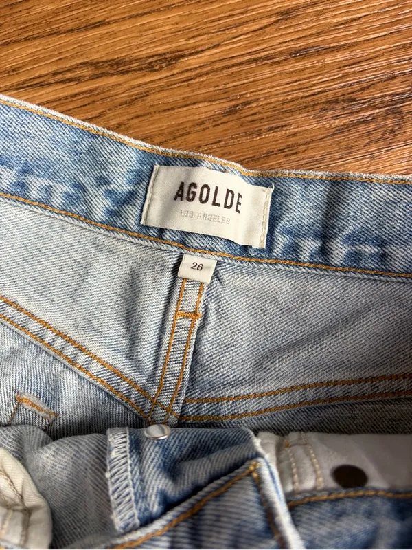 Agolde Faded Light Blue Distressed Denim Cutoff Shorts - Image 2