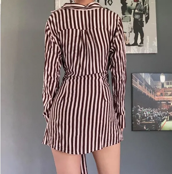 Jen’s Pirate Booty Amaya brown and white striped mini dress in size XS. This has only been worn once and has no rips, tears, or stains. Some color transfer between stripes from washing but it’s not really noticeable as seen in photos. The waist can be tied in front with excess or in back (I like to go around twice and tie in back). Ultra soft and flowy material, love this dress and only selling as it just isn’t quite my style. Measures 30” long, 17” across chest, 14” across at waist, 22” long sleeve (from shoulder seam). - Image 4