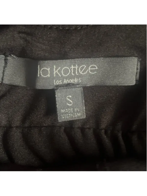Black athletic dress with built-in shorts with side pockets and a sports bra. - Image 4