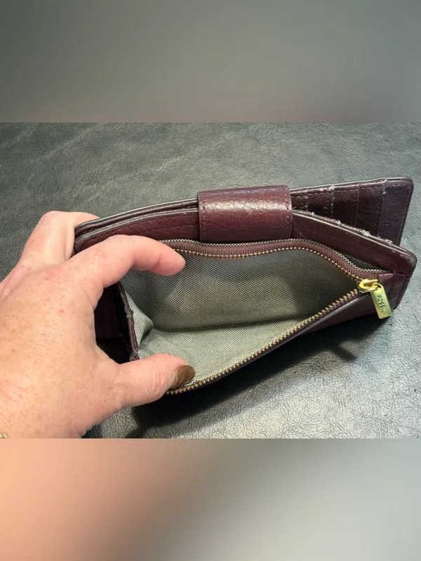 Fossil pebbled leather tab clutch wallet in a deep burgundy or berry color - Image 6