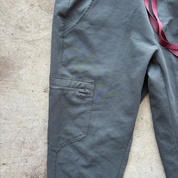FIGS Zamora Jogger Scrub Pants in the limited-edition bonsai green colorway, featuring a comfortable yoga waistband and contrasting reddish drawstring - Image 3