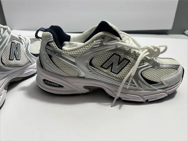 New Balance women’s sneakers in white and navy. Clean and stylish design with a comfortable cushioned insole and lace-up closure. Made in Vietnam. Size 9 US (40.5 EU / 25.5 CM). Great for everyday wear, walking, or casual outfits. Excellent condition - Image 12