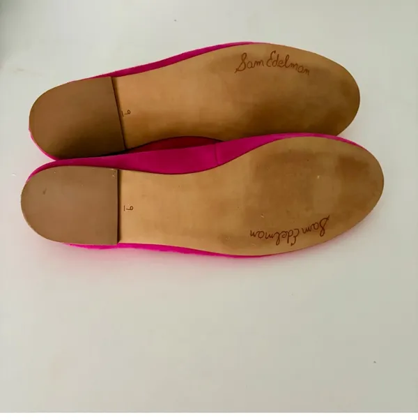 Vibrant pink suede, leather ballet flats by Sam Edelman. Featuring a rounded toe with silver logo charm detail. Perfect for adding flair to any outfit. - Image 7