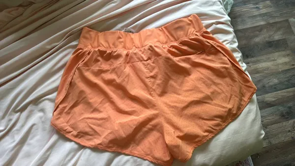 ASICS Women’s Athletic Shorts running orange medium - Image 3